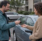 Owner hands car keys to a friend