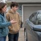 Parent and teen discussing auto insurance
