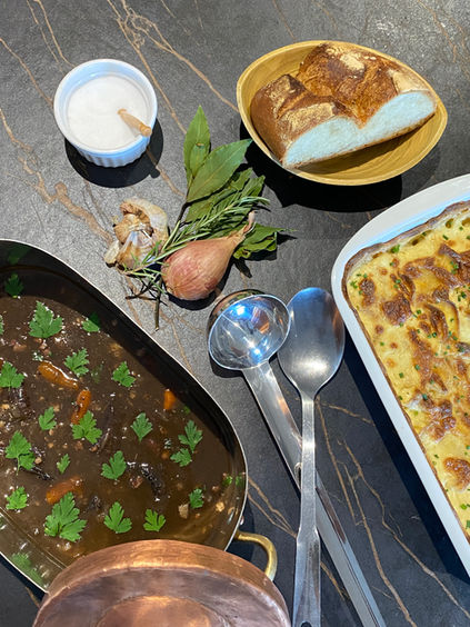 Chef-style Boeuf Bourguignon served with creamy Gratin Dauphinois in a copper daubière at The Walnut Grove Cookery School