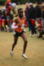 Ahmed Muhumed races toward the finish line at the USATF Cross Country Championships on Dec. 6 at Glendoveer Golf Course in Portland, Oregon. Photo Credit: Griffen Lawrence