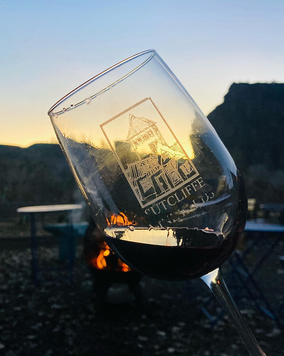 a wine glass in front of fire