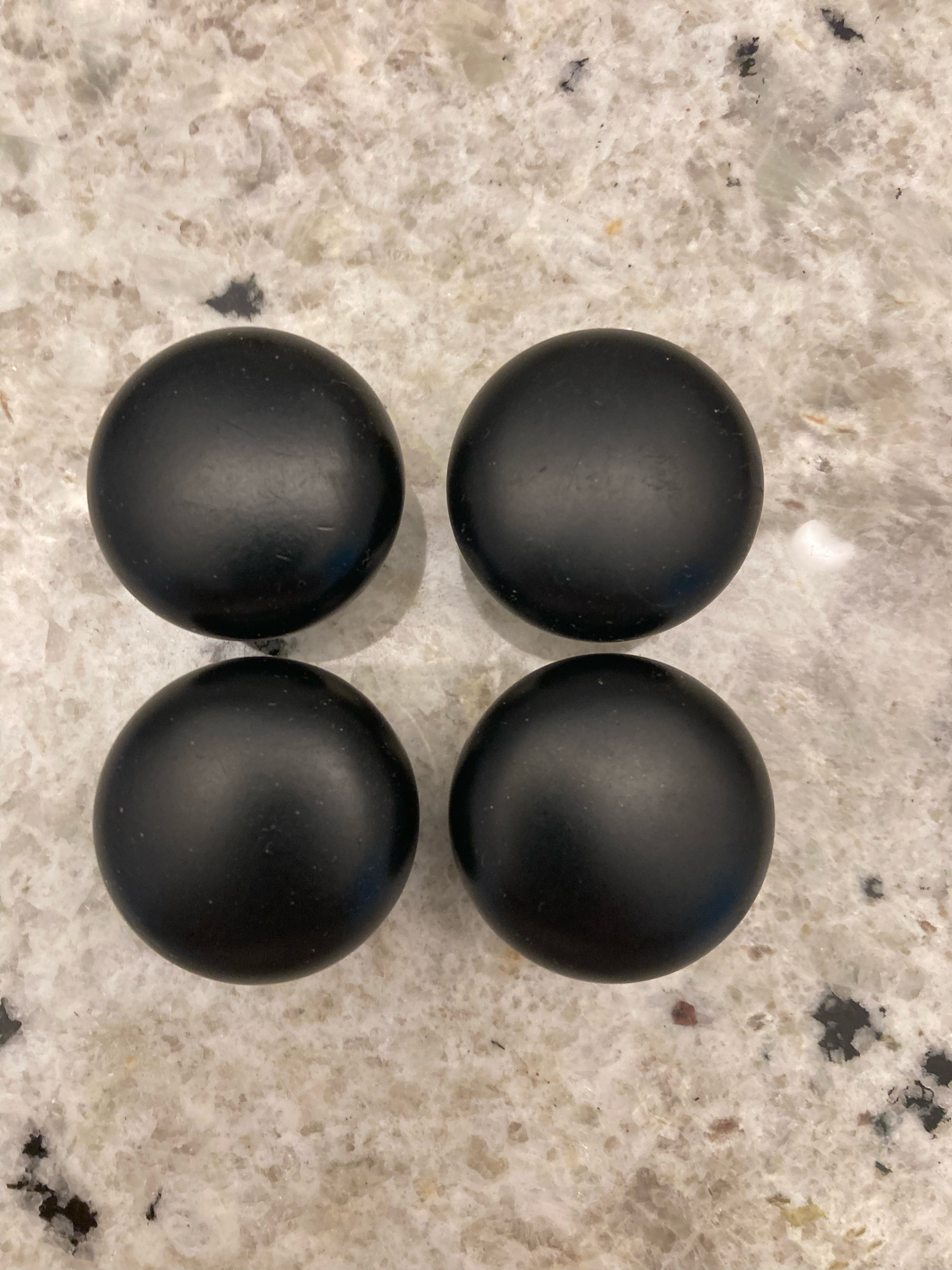Four Black Metal Knobs