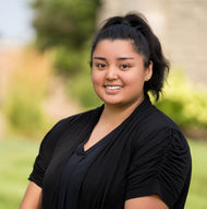 Smiling woman in black top poses outdoors, smiling confidently ABOUT Hardon Education
