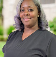 Smiling woman wearing black top poses for a portrait, Hardon Education.