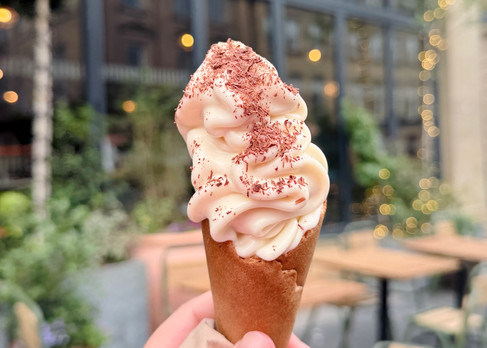 Complimentary soft serve ice cream cone with chocolate shavings outside Flat Iron Newcastle.
