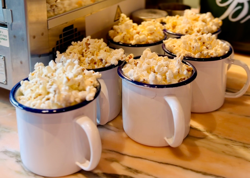 Mugs filled with complimentary popcorn at Flat Iron Newcastle.