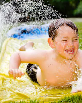 happy-child-on-water-slide-260nw-1015190