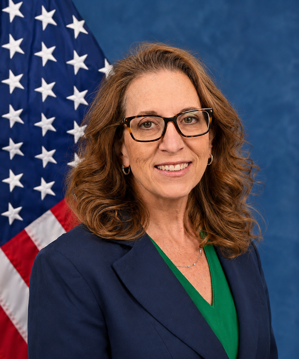 Formal portrait with U.S. flag.png