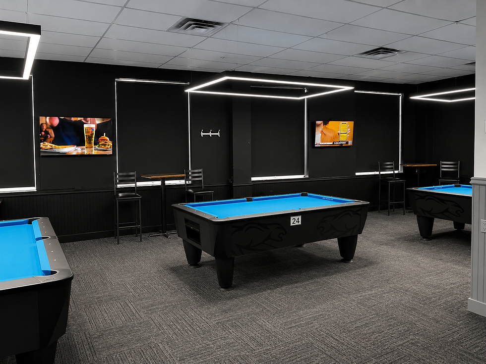 Modern newmarket pool hall with blue felt tables and LED lights.