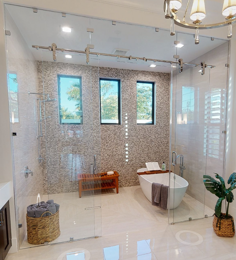 Frameless double sliding Laguna barn door shower with fixed panels and transom brushed nickel