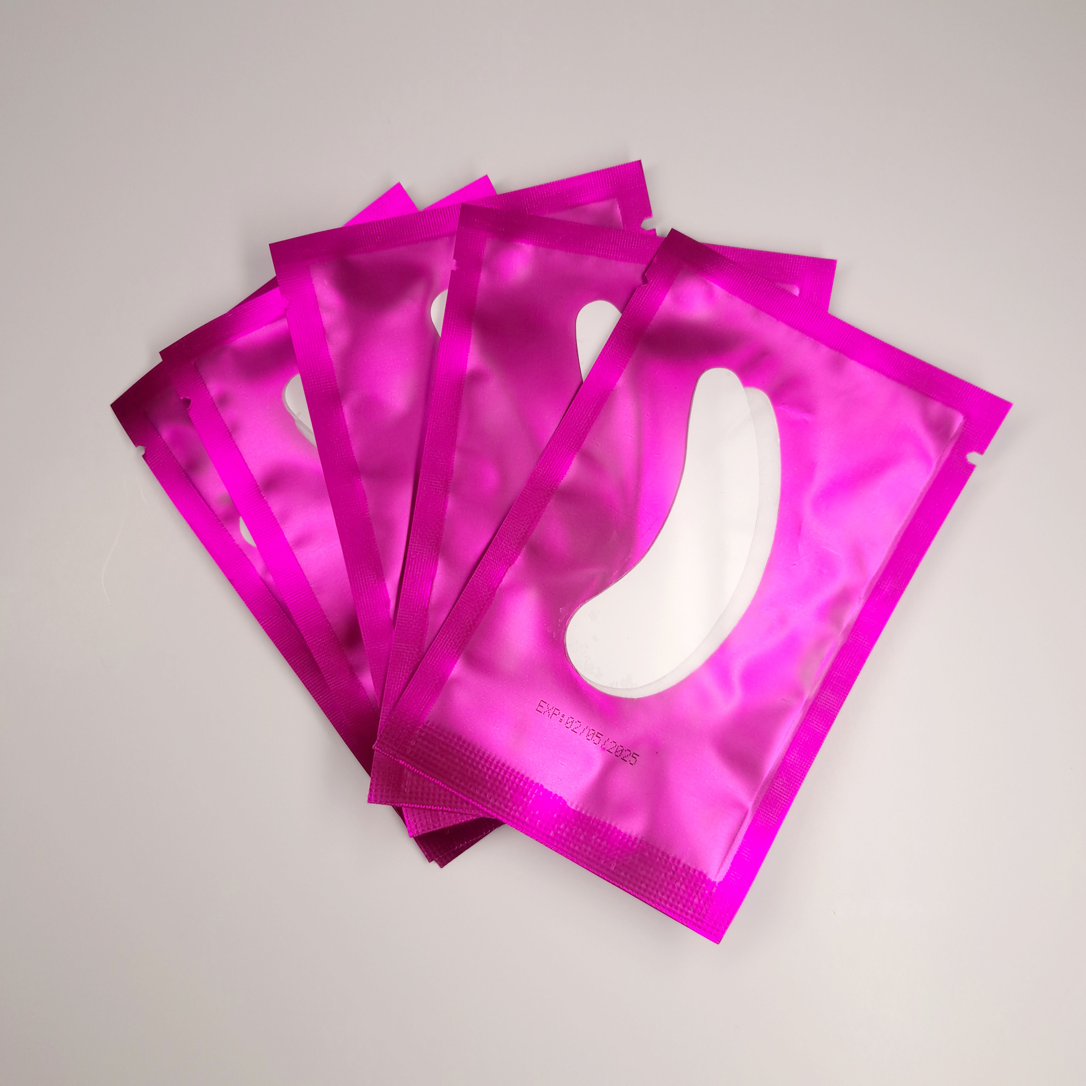 package of eyepads with pink packaging