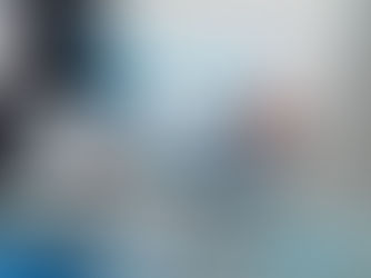 Hands typing on a laptop with digital icons overlay, including a shield and graphs, suggesting cybersecurity. The mood is focused.