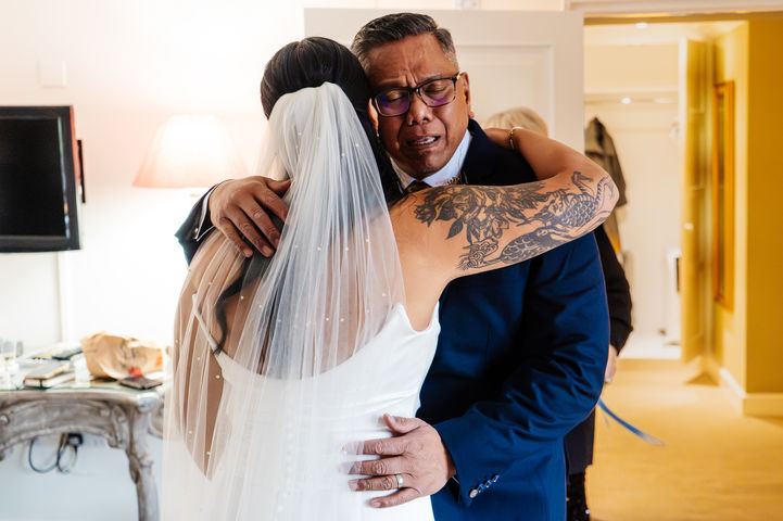 Father of the hugging bride