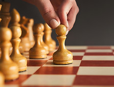 hand-of-player-chess-board-game-putting-