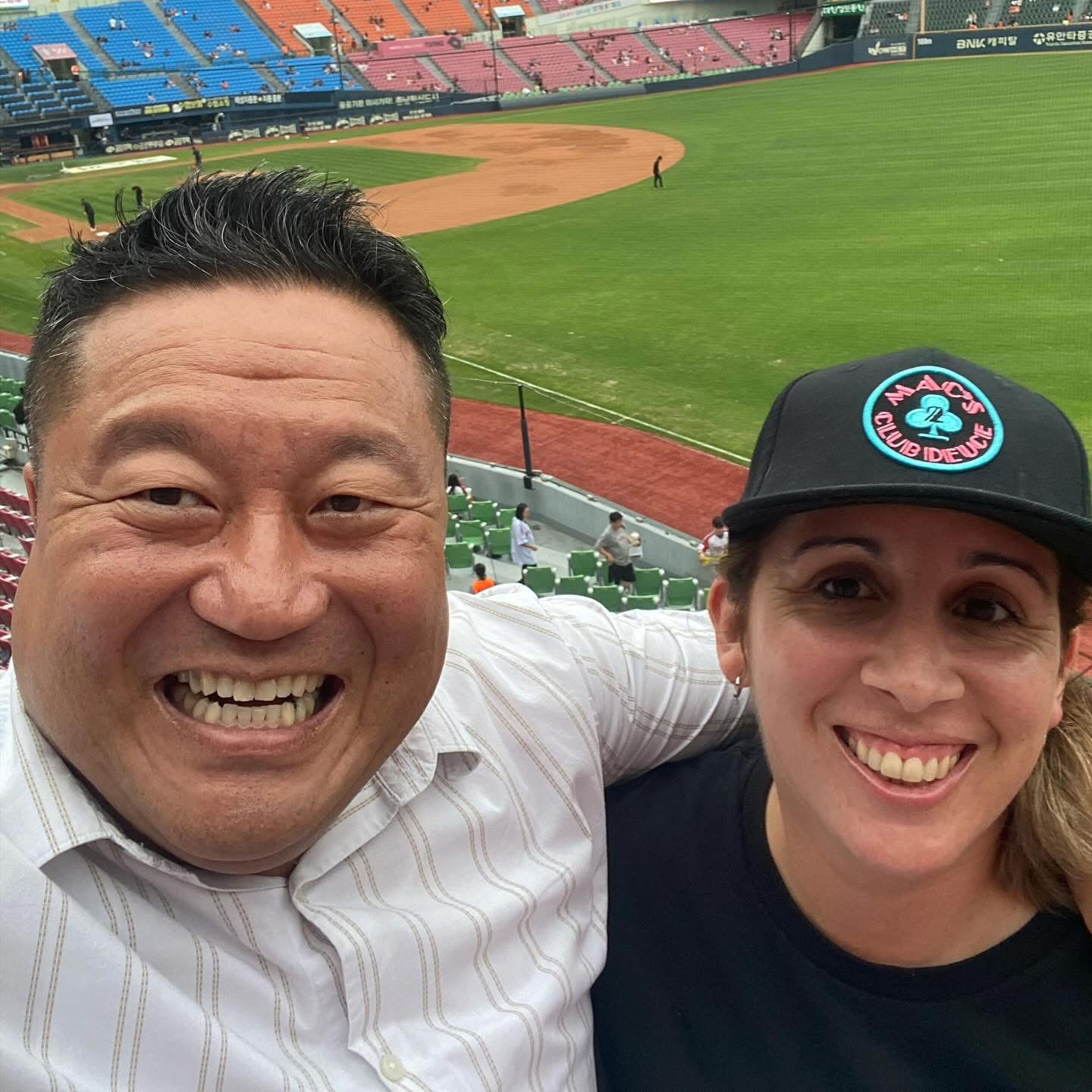 One of our favorite people wearing the Mac's Club Deuce logo in Miami Vice pink and blue on a snapback baseball cap at the baseball park.