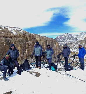 Group of guided birdwatchers walking on trail