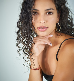 pretty-woman-curly-hair-poses-front-camera.jpg