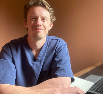 Dr William Shaw, founder of New Jackson Healthcare, in clinic setting in Manchester