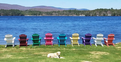 Multicolor set of Adirondack Chairs set near Lake Champlain.