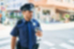 Police officer enjoying a coffee break while on duty in the city.