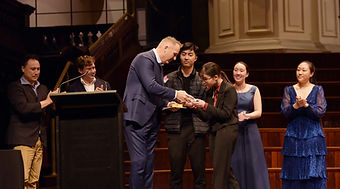 Rae Pung accepts a $12,000 cash prize at Sydney Eisteddfod Competition