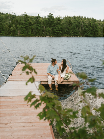 Whimsical boho bride walking in the forest wearing a lightweight tulle bridal gown