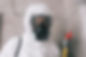 pest-control-worker-standing-in-respirator-in-bathroom.jpg