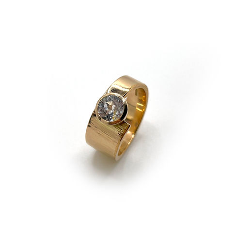 Handmade 14ct and 22ct angular hammered ring set wit sentimental white sapphire