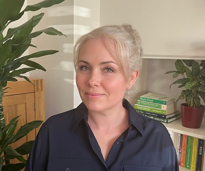living rCertified naturopathic nutritionist conducting a consultation with a client