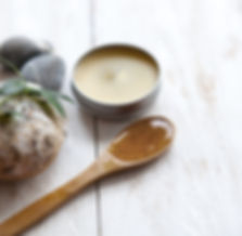 a candle with a spoonful of hoey