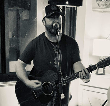 Musician playing acoustic guitar