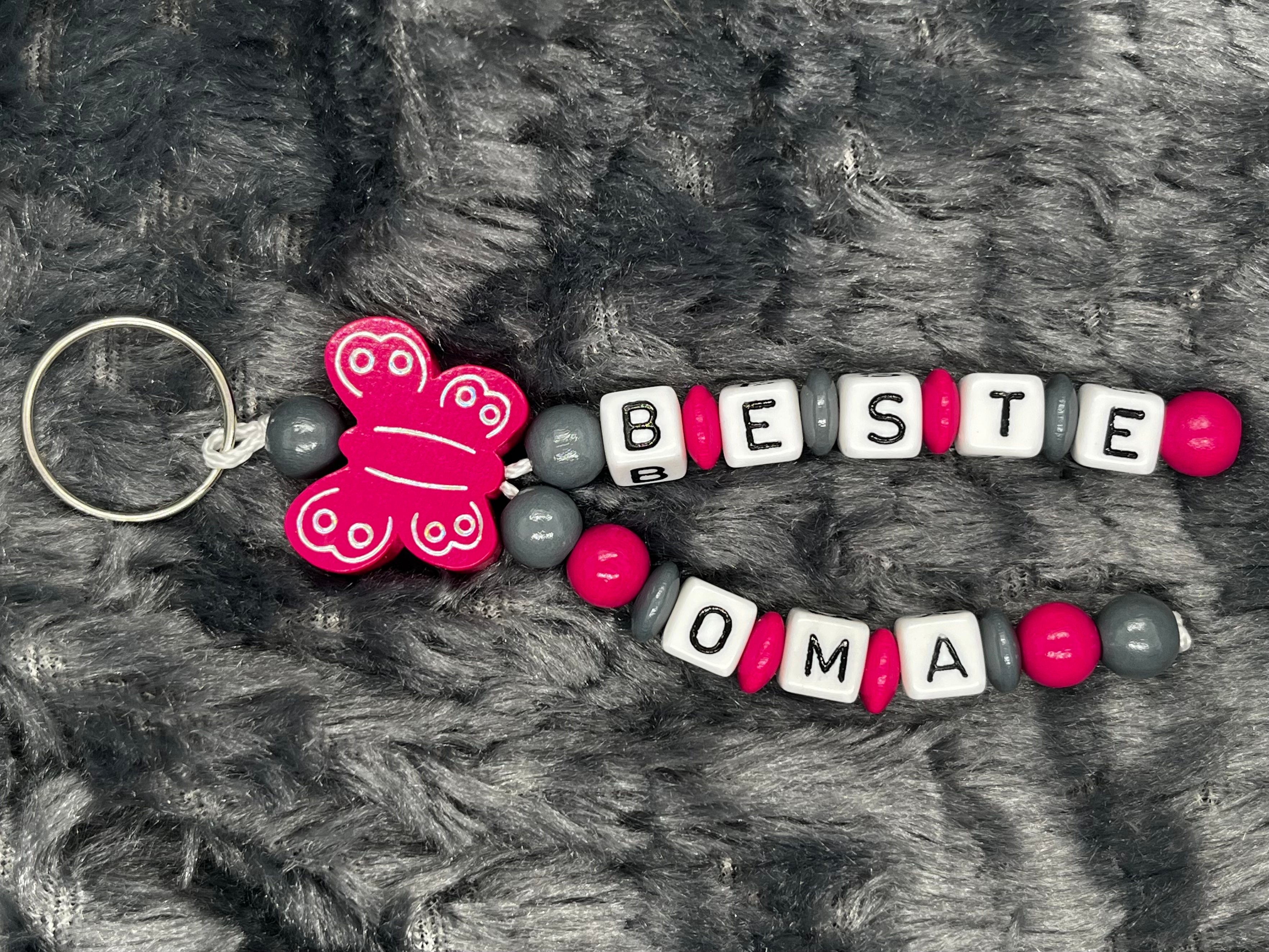 Schlüsselanhänger Schmetterling dunkelpink "beste Oma"