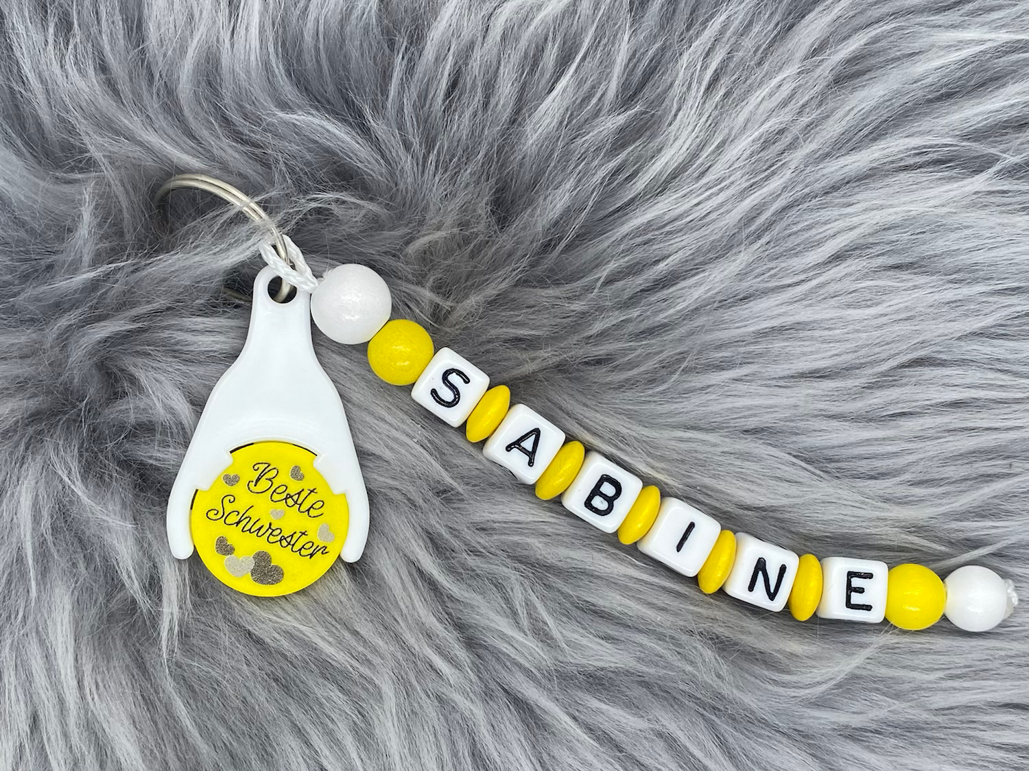 Schlüsselanhänger mit Einkaufswagenchip gelb "Beste Schwester"