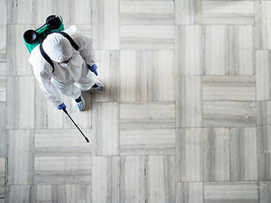 person-white-chemical-protection-suit-doing-disinfection-public-areas-stop-spraying-highly