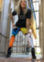 Blonde woman wearing tshirt that says RATIONAL CREATURES, Jane Austen illustrated tights and high-heeled black boots