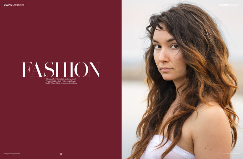 Fashion editorial cover portrait of woman with long hair against red background by Abram Katz.