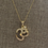 Thumbnail: Gold & CZ Ohm Necklace