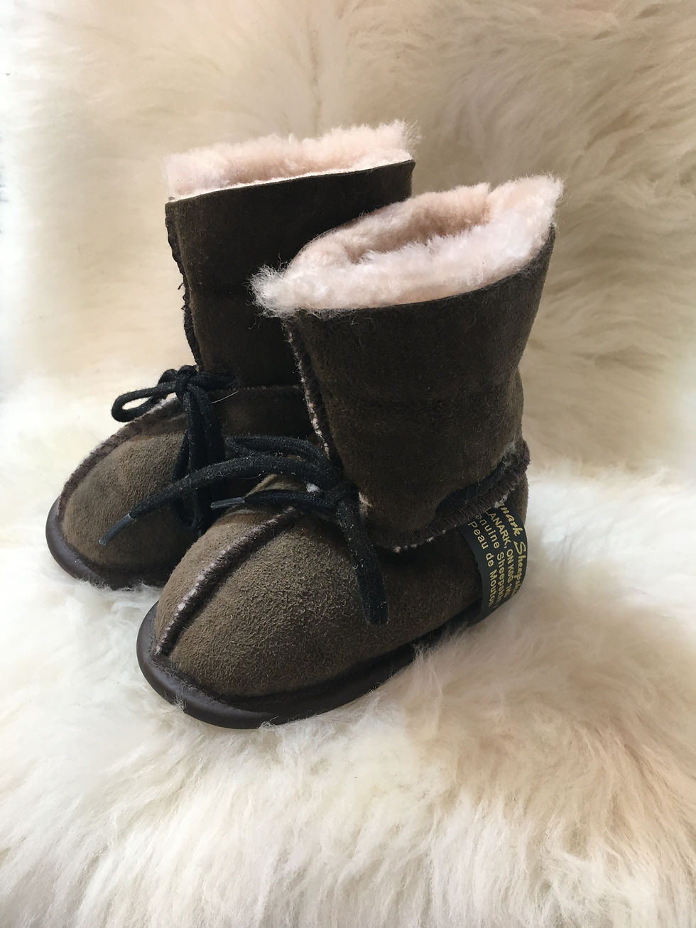 Thumbnail: Side view of pair of toddler denim sheepskin slippers