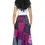 Thumbnail: Back view of model in long purple & pink patchwork skirt with drawstring waist