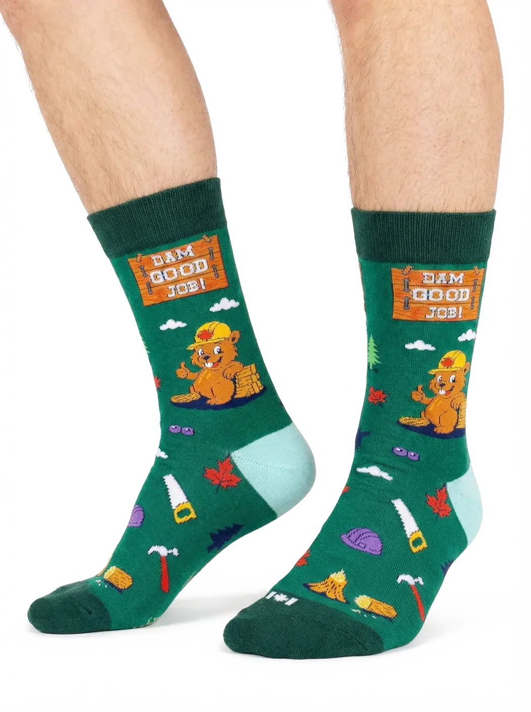 Side view of green socks with beaver print & text, 'Dam Good Job' at Tickled Pink Ottawa