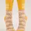 Thumbnail: Front view of pair of yellow socks with tan & beige print, text, 'Mind Reader'