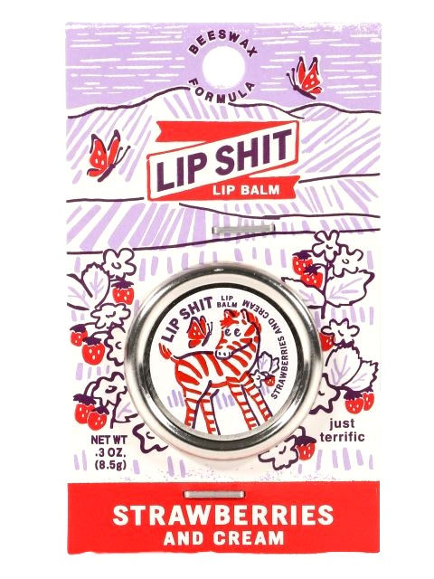 Red & white cardboard package holding small round tin of Strawberries & Cream lip balm, zebra on lid, text, 'Lip Shit'