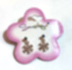 Pink & white flower shaped card holding silver snowflake stud earrings