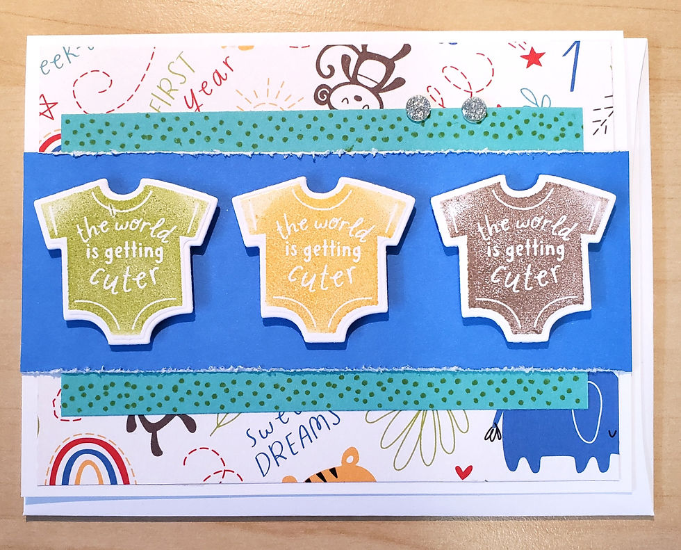 Handmade card with 3 onesies printed with 'The World is Getting Cuter'