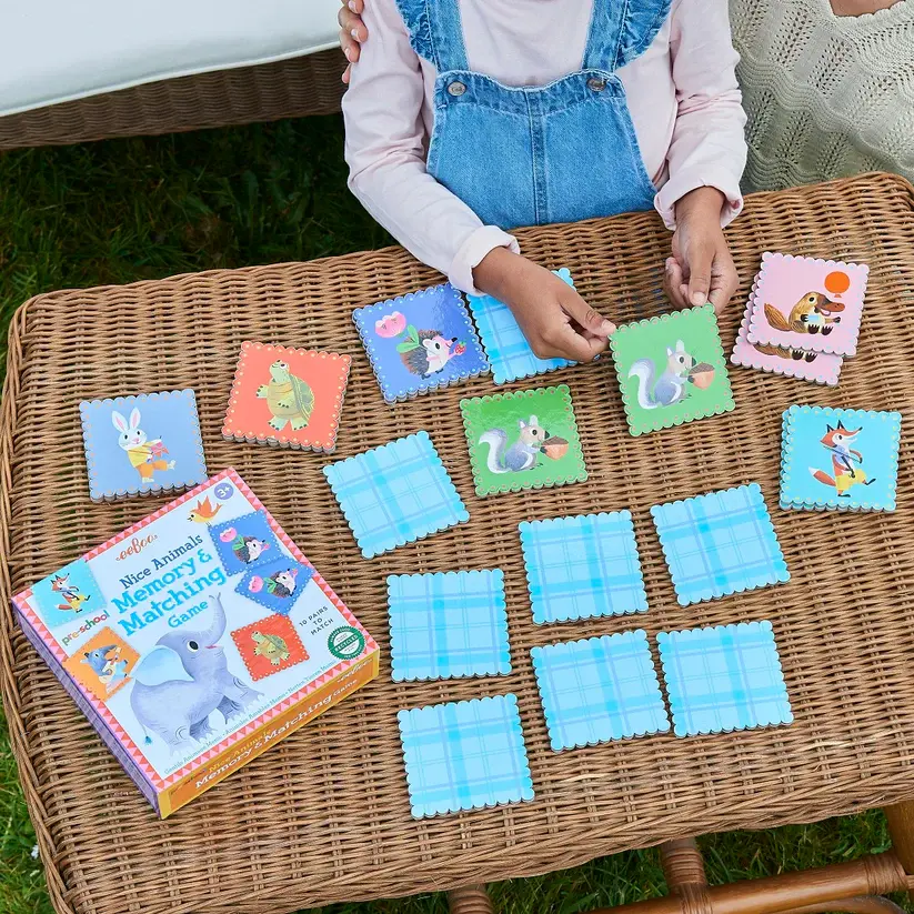 Child at table playing Pre-school Nice Animals Matching Game