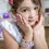 Thumbnail: Model wearing stretchy link bracelet with large rectangular iridescent crystals in gold colored metal setting