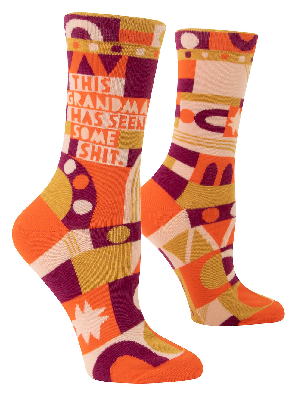 Side view of orange, magenta, gold & tan geometric print socks with text, "This Grandma's seen some shit."