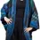 Thumbnail: Front view of model in cocoon shaped kimono style long jacket of blue patchwork with long sleeves