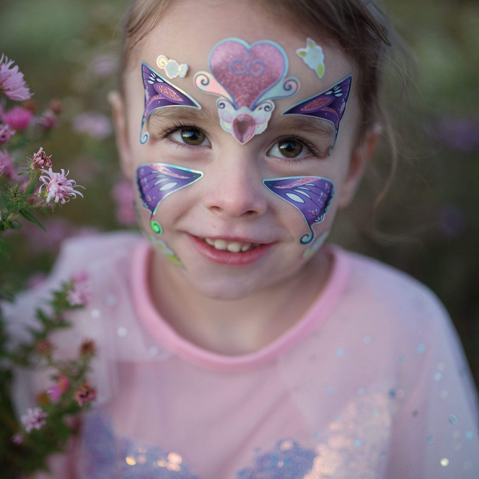 Child wearing pink & purple butterfly fairy face stickers