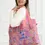 Thumbnail: Pink wide handled reusable shopping bag with blue & pink print of cowboy hats & boots & horse shoes, text, 'Let's Go Girls'